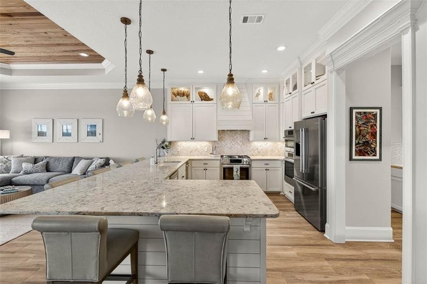 Welcome to a refined coastal sanctuary in the gated enclave of - photo 19