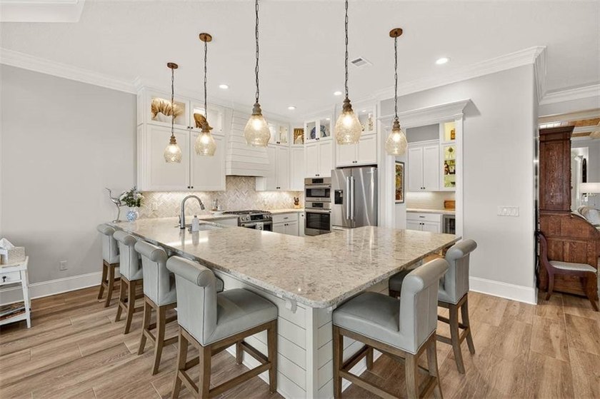 Welcome to a refined coastal sanctuary in the gated enclave of - photo 20
