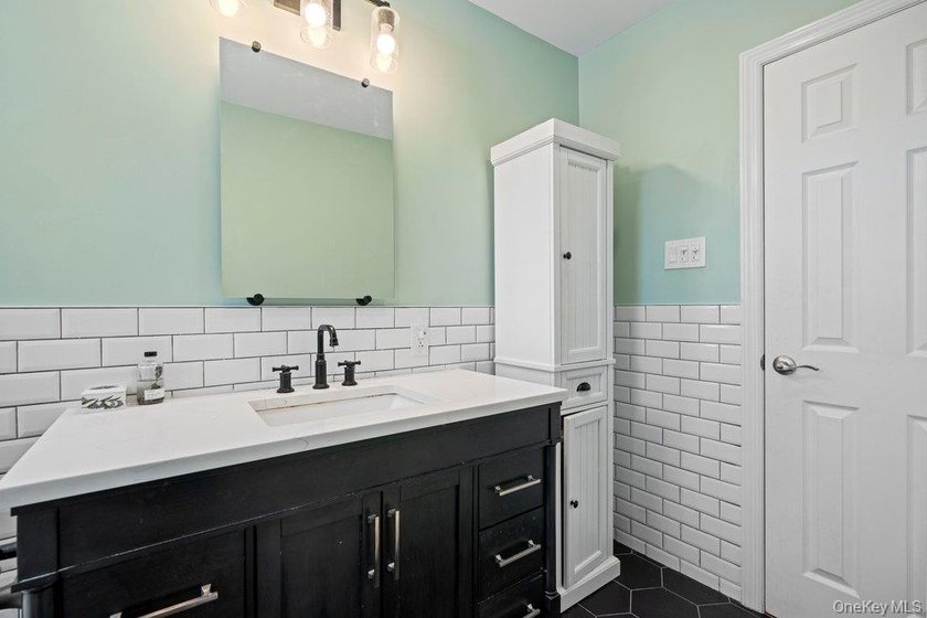 Welcome to 60 Leewater Ave. This sprawling split-level three - photo 20