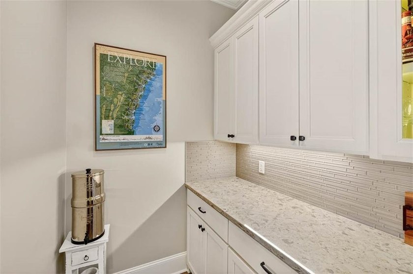 Welcome to a refined coastal sanctuary in the gated enclave of - photo 23