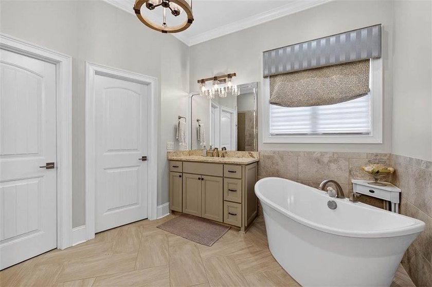 Welcome to a refined coastal sanctuary in the gated enclave of - photo 29