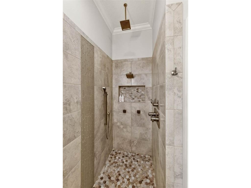 Welcome to a refined coastal sanctuary in the gated enclave of - photo 30