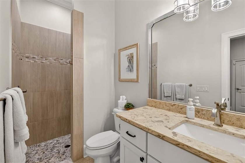 Welcome to a refined coastal sanctuary in the gated enclave of - photo 36