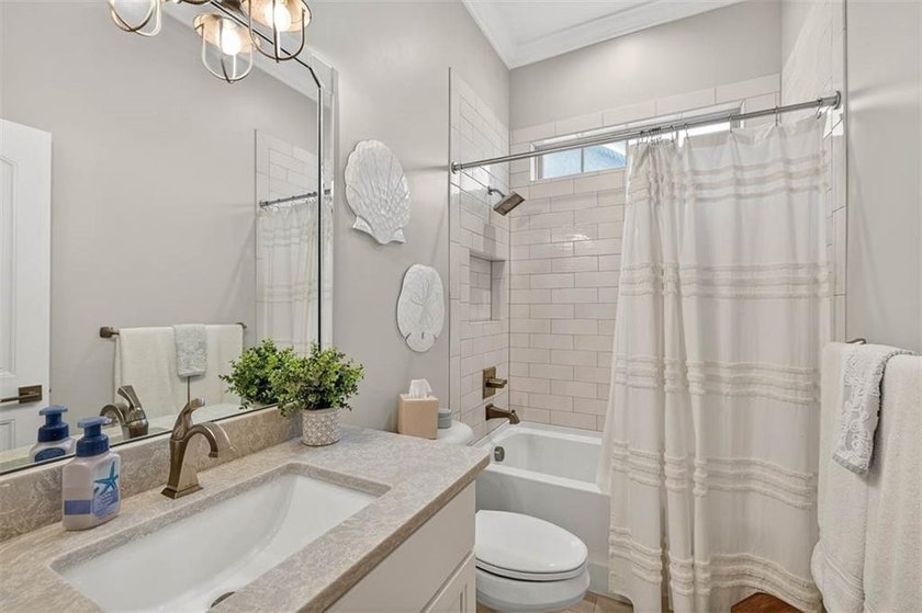 Welcome to a refined coastal sanctuary in the gated enclave of - photo 42