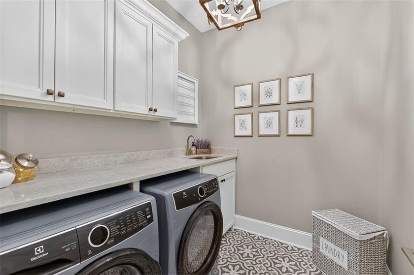 Welcome to a refined coastal sanctuary in the gated enclave of - photo 43