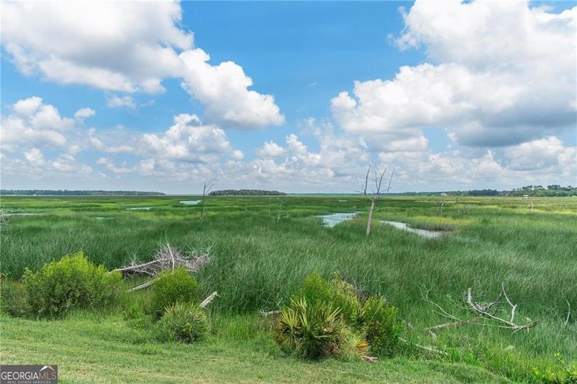Welcome to a refined coastal sanctuary in the gated enclave of - photo 47