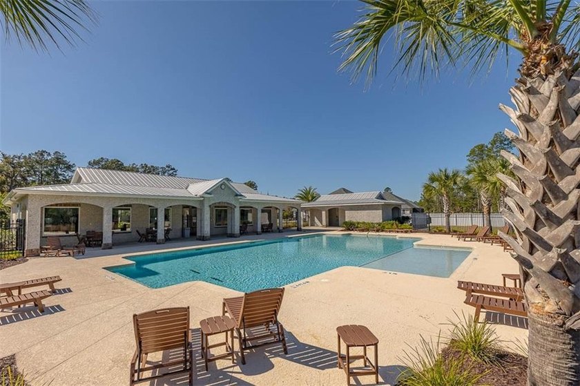 Welcome to a refined coastal sanctuary in the gated enclave of - photo 56
