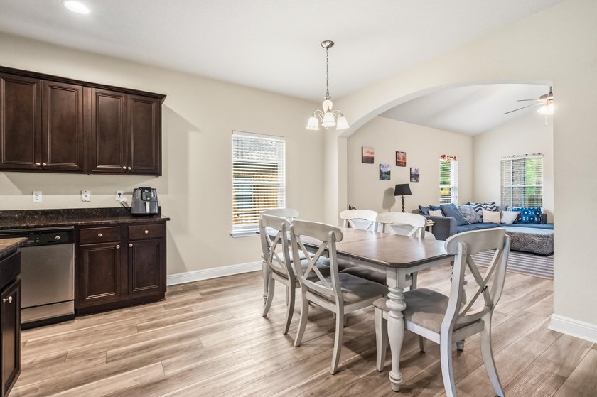 Newer LVP flooring flows through this open-concept Hammock Bay - photo 11