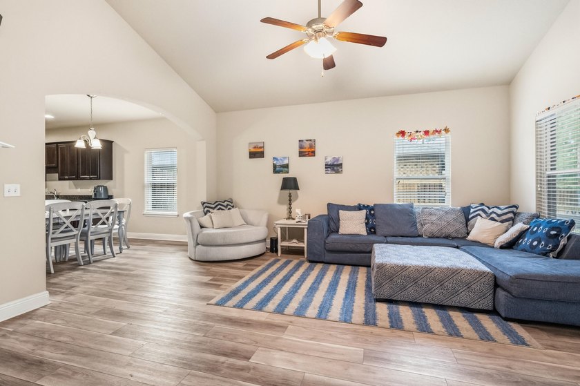 Newer LVP flooring flows through this open-concept Hammock Bay - photo 15