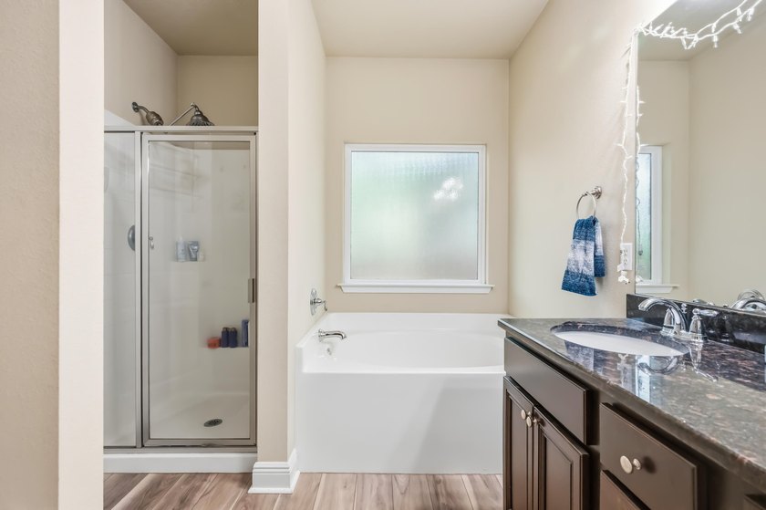 Newer LVP flooring flows through this open-concept Hammock Bay - photo 20