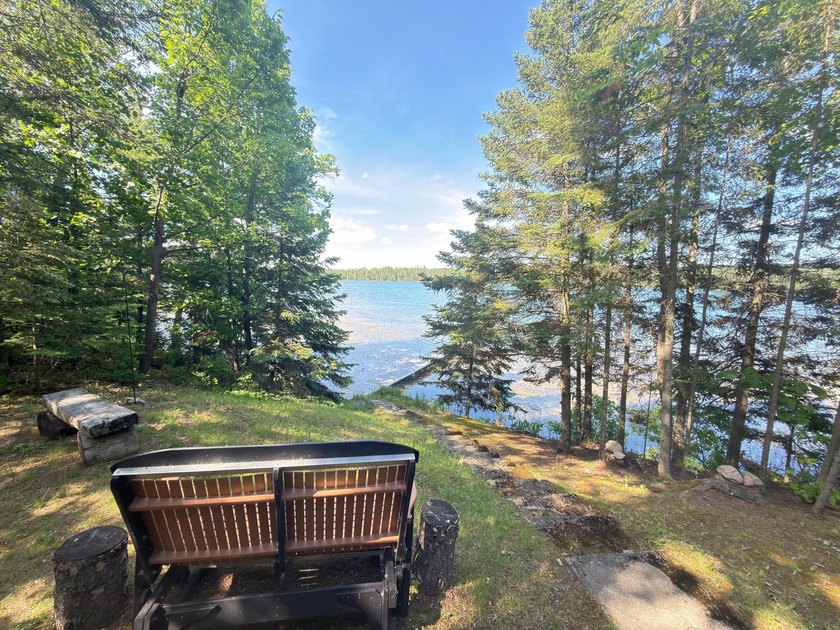 Discover your perfect escape on Mantrap Lake, one of the area's - photo 15