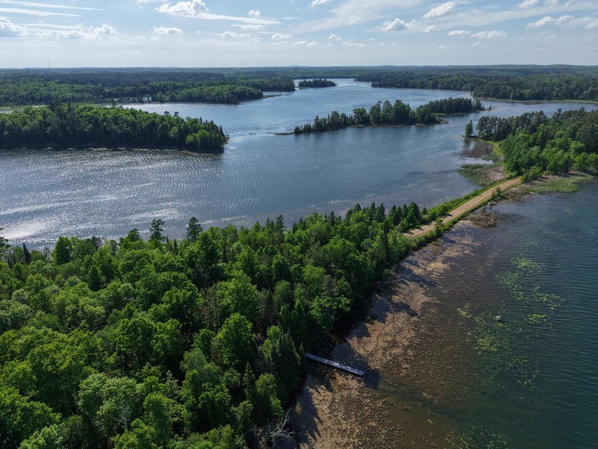 Discover your perfect escape on Mantrap Lake, one of the area's - photo 24