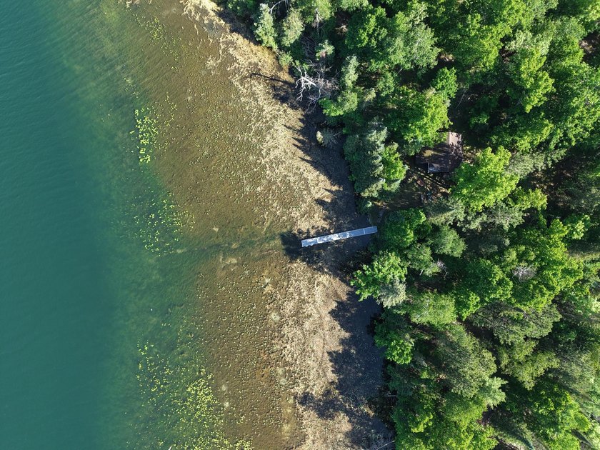 Discover your perfect escape on Mantrap Lake, one of the area's - photo 27