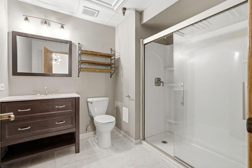 Located on a quiet street in the heart of the North Loop, you - photo 16