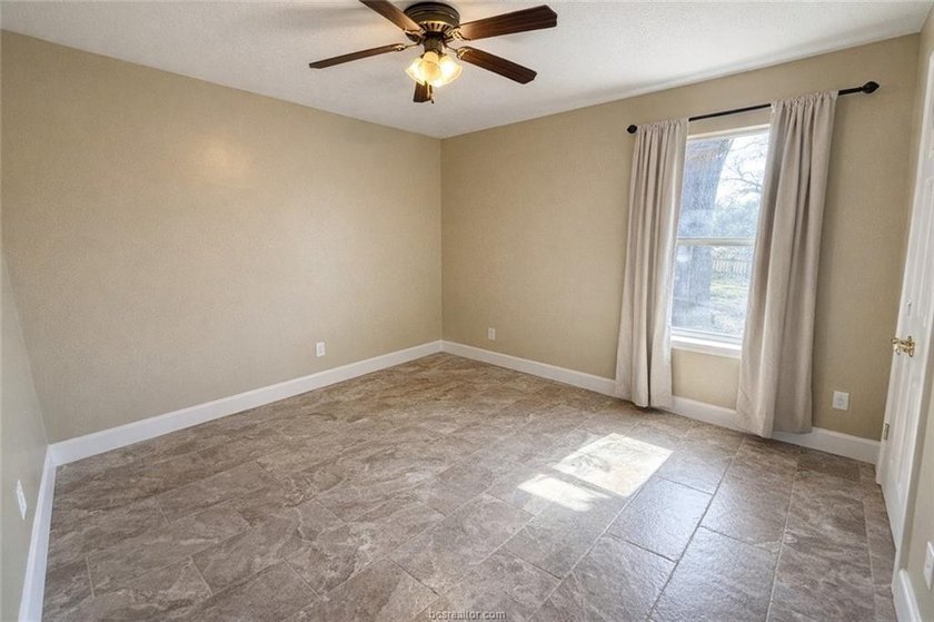Situated on nearly three-quarters of an acre beneath mature - photo 13