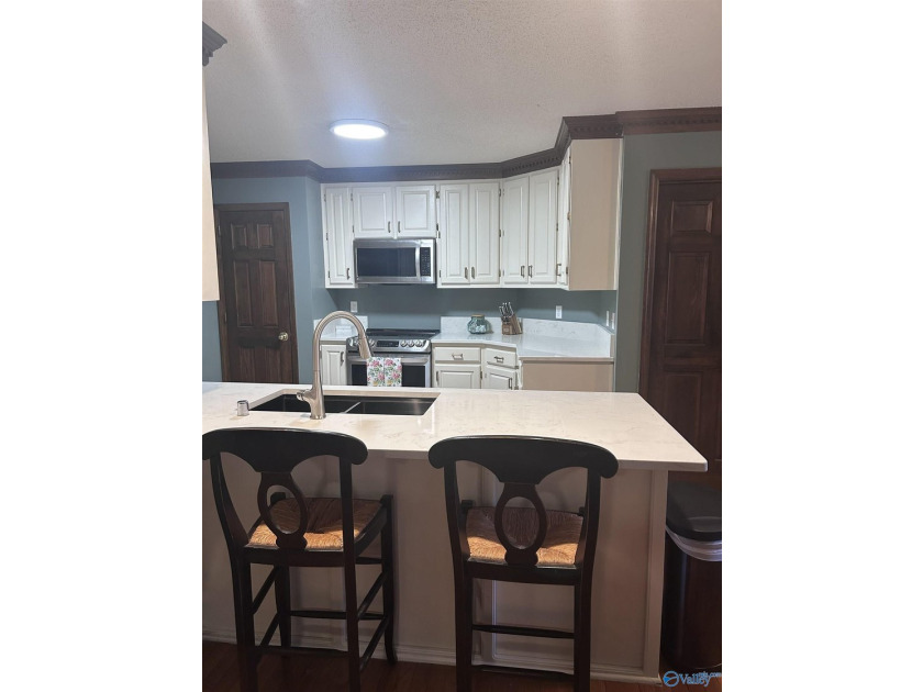 Welcome home to this beautifully renovated 4-bedroom residence - photo 9