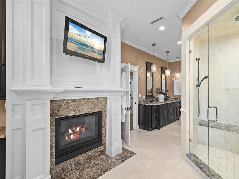 Welcome to an extraordinary waterfront estate in the prestigious - photo 22
