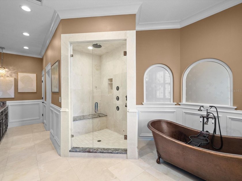 Welcome to an extraordinary waterfront estate in the prestigious - photo 23