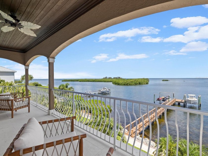 Welcome to an extraordinary waterfront estate in the prestigious - photo 27