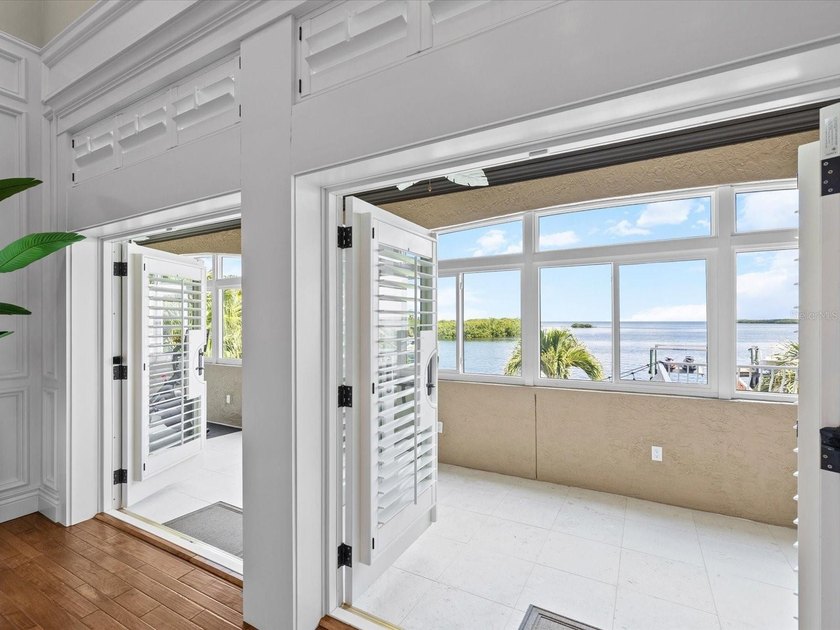 Welcome to an extraordinary waterfront estate in the prestigious - photo 34