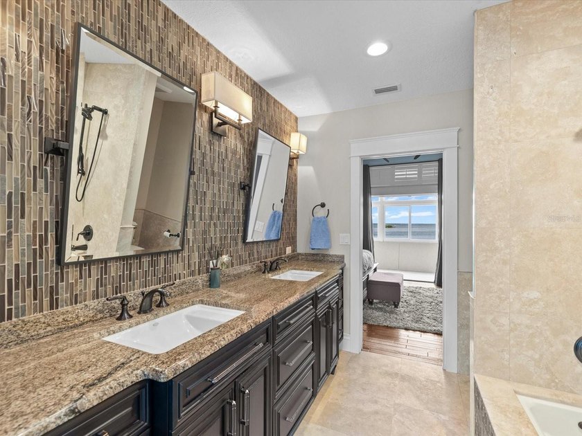 Welcome to an extraordinary waterfront estate in the prestigious - photo 38