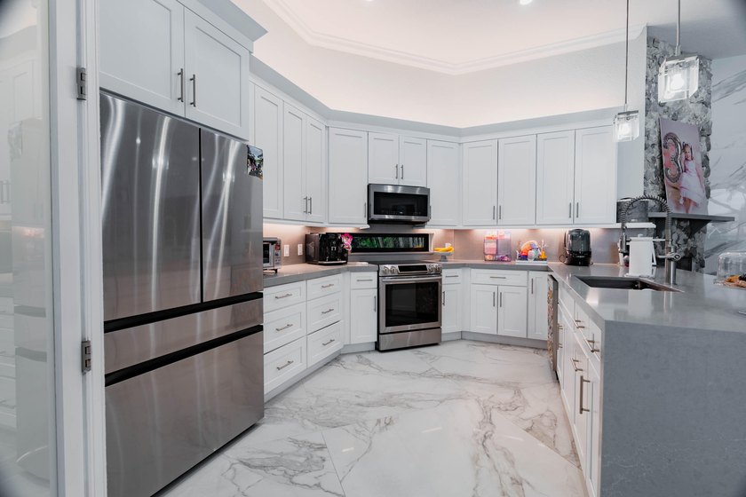 Welcome to this fully renovated lakefront home tucked away on a - photo 15