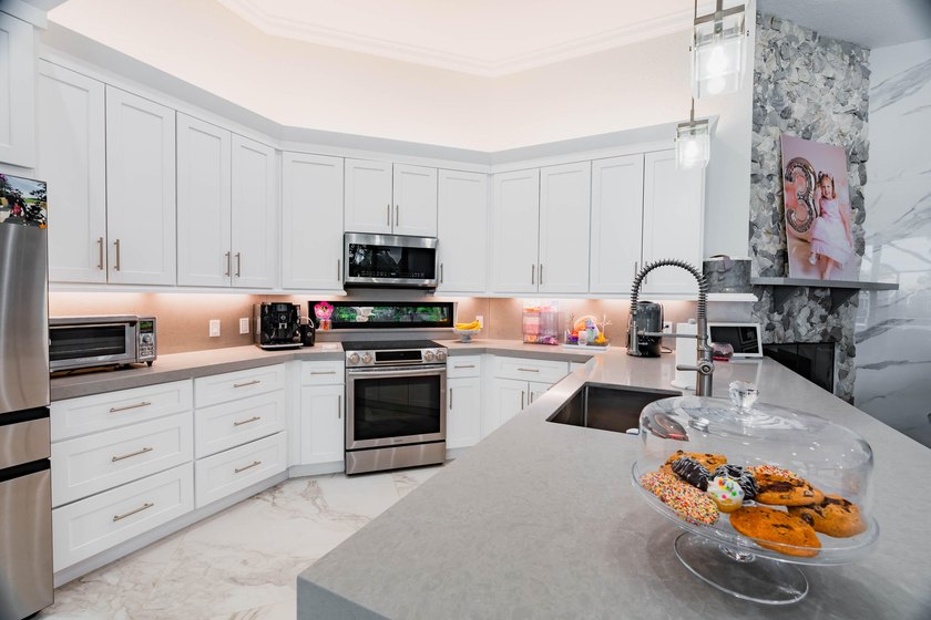 Welcome to this fully renovated lakefront home tucked away on a - photo 16