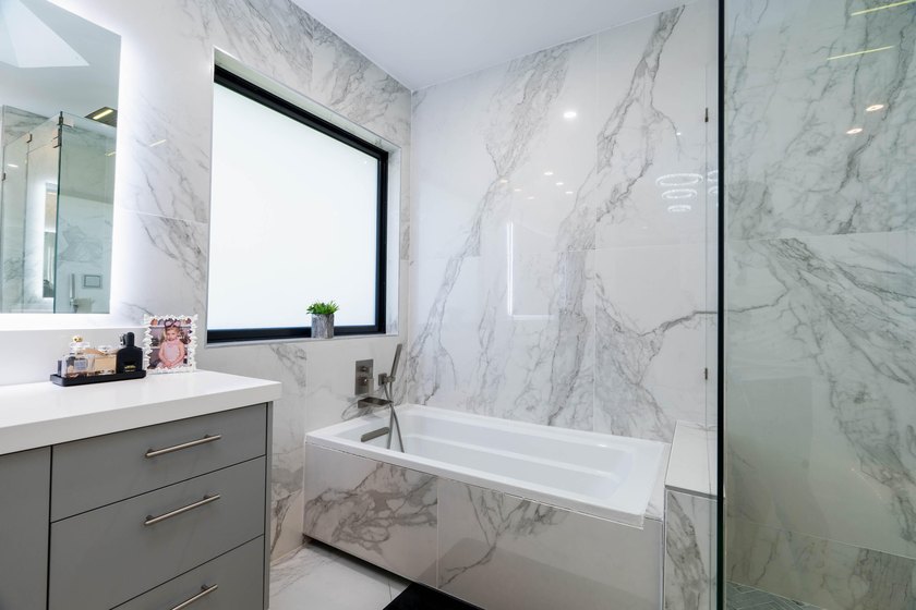 Welcome to this fully renovated lakefront home tucked away on a - photo 33