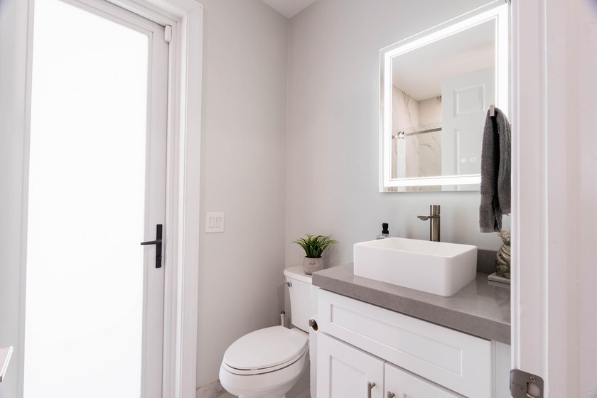Welcome to this fully renovated lakefront home tucked away on a - photo 38