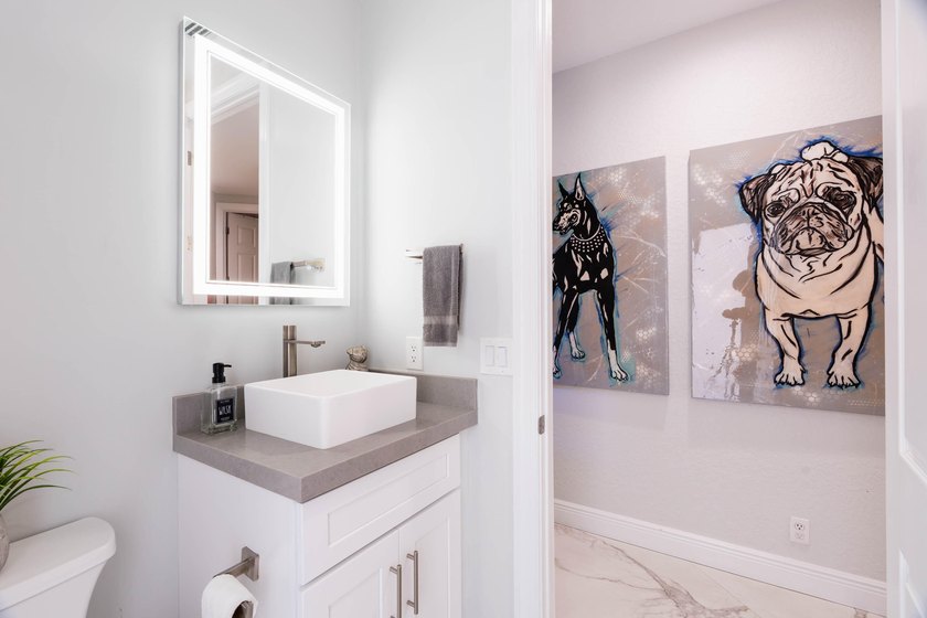 Welcome to this fully renovated lakefront home tucked away on a - photo 50