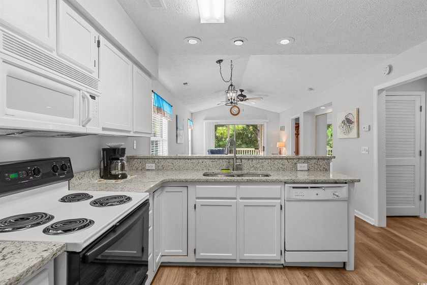 This move-in ready third-floor condo in the River Oaks community - photo 3