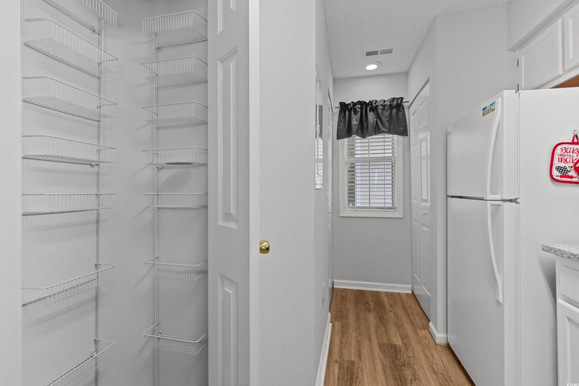 This move-in ready third-floor condo in the River Oaks community - photo 5
