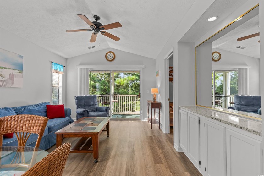 This move-in ready third-floor condo in the River Oaks community - photo 6