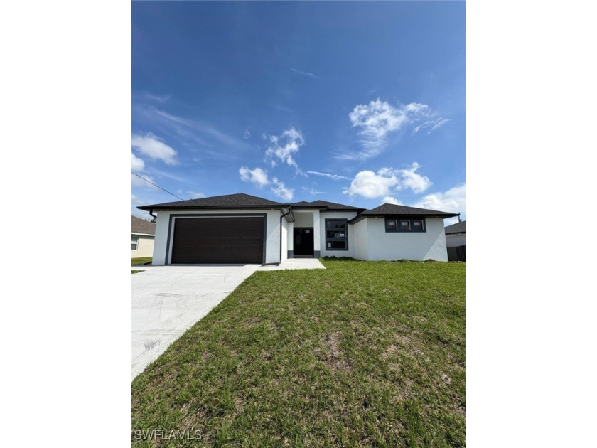 This stunning new construction features impact windows and doors - photo 2