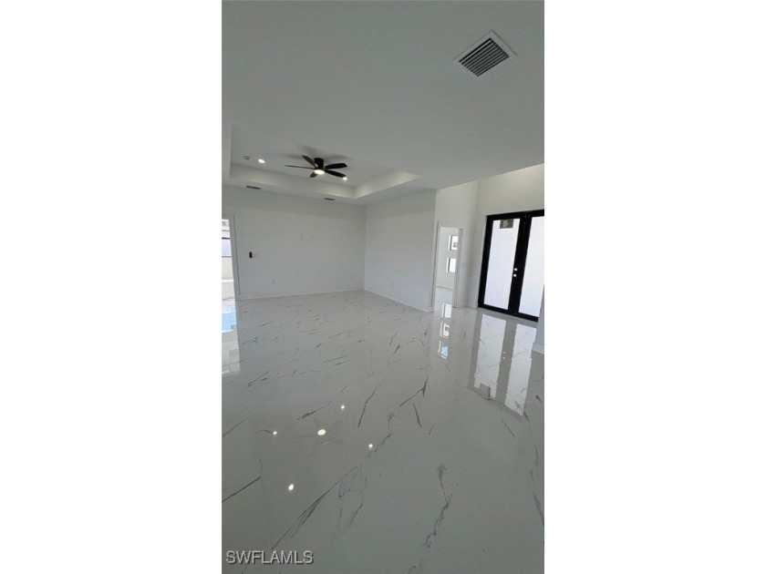 This stunning new construction features impact windows and doors - photo 3