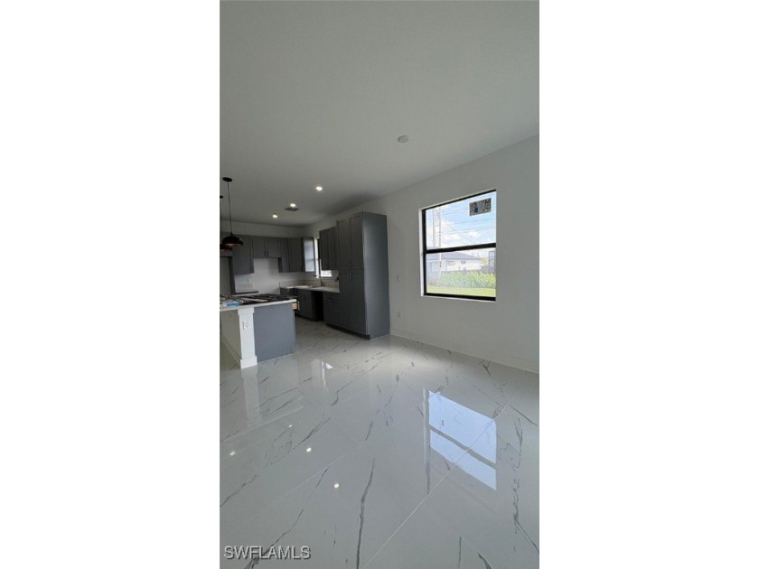This stunning new construction features impact windows and doors - photo 6