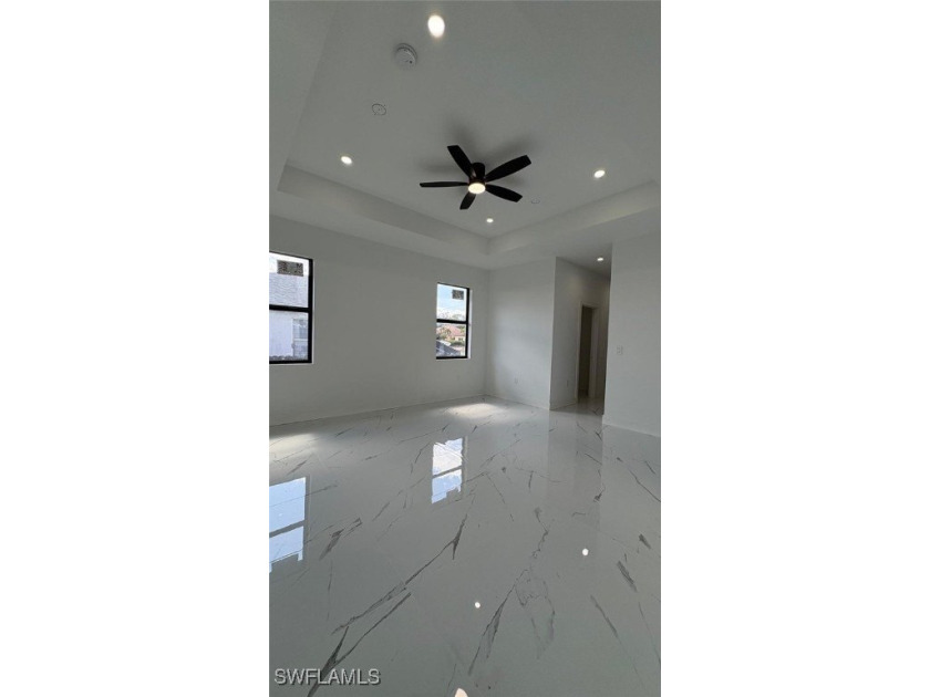 This stunning new construction features impact windows and doors - photo 8
