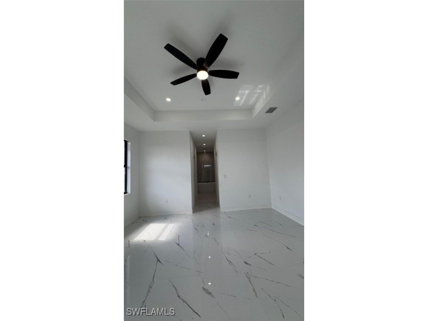 This stunning new construction features impact windows and doors - photo 9