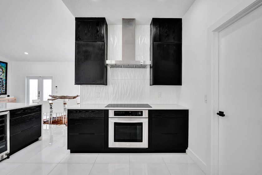 $35,000 ROOF CREDIT. NEW: AC, IMPACT WINDOWS &amp; CUSTOM KITCHEN - photo 14