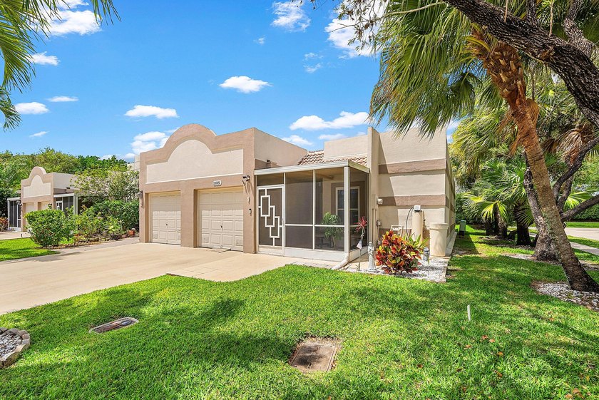 Tucked away as a private end-unit in desirable Town Villas, this - photo 2