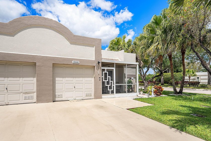 Tucked away as a private end-unit in desirable Town Villas, this - photo 3