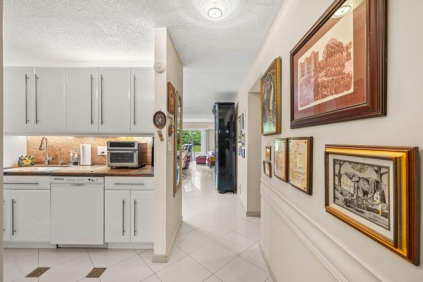 Tucked away as a private end-unit in desirable Town Villas, this - photo 9