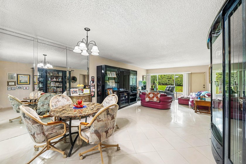 Tucked away as a private end-unit in desirable Town Villas, this - photo 10