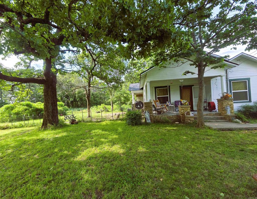 Charming Mena Home with Modern Upgrades &amp; Endless Potential! - photo 2