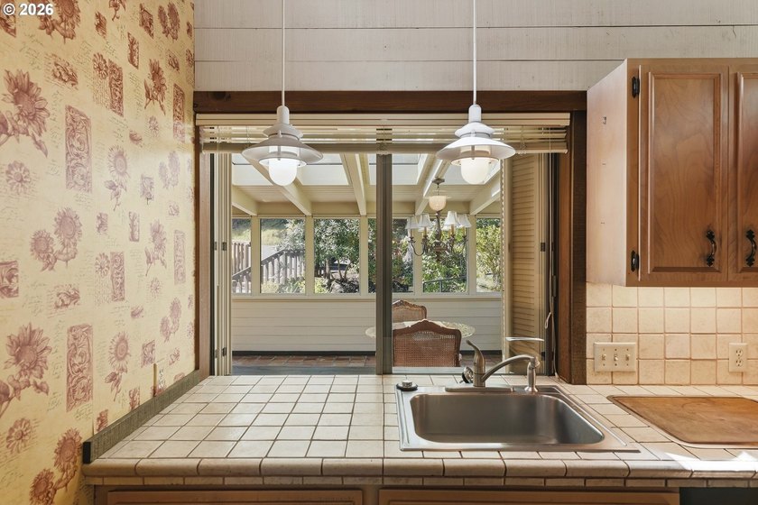 Custom townhouse tucked away on 3+ private, in-town acres - photo 12