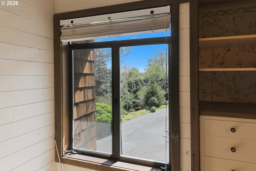 Custom townhouse tucked away on 3+ private, in-town acres - photo 28