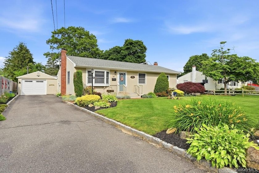 This immaculate 3 bedroom 1.5 bath home sits on a beautifully - photo 2