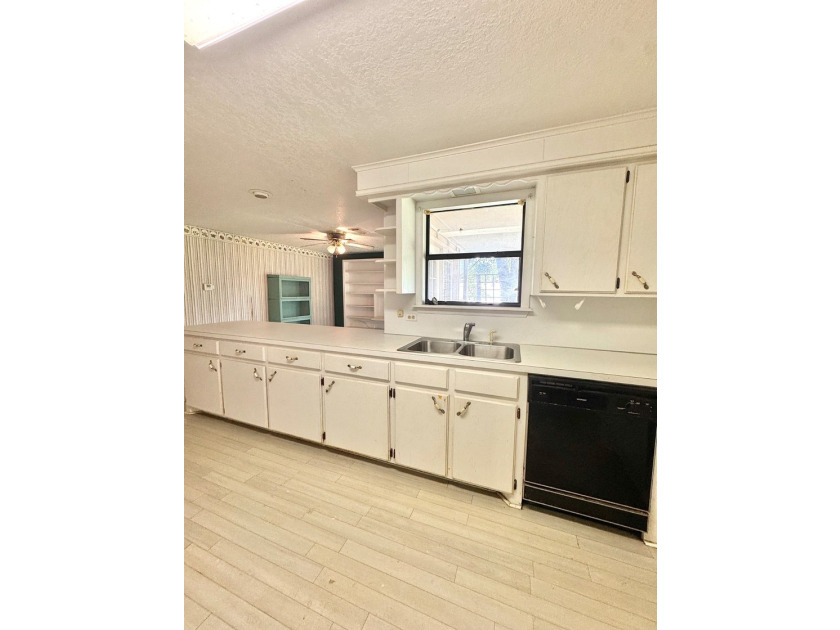 Welcome to this solidly built 3-bedroom, 2-bath home nestled on - photo 9