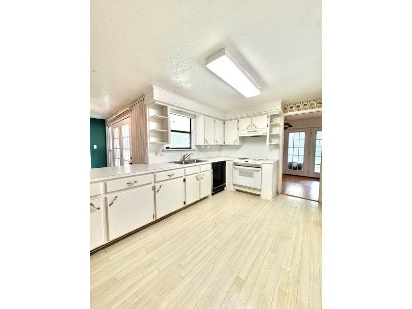 Welcome to this solidly built 3-bedroom, 2-bath home nestled on - photo 10