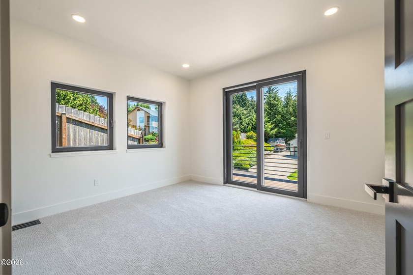 Just completed new construction, this modern residence blends - photo 49